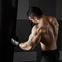 Muscular man practicing boxing