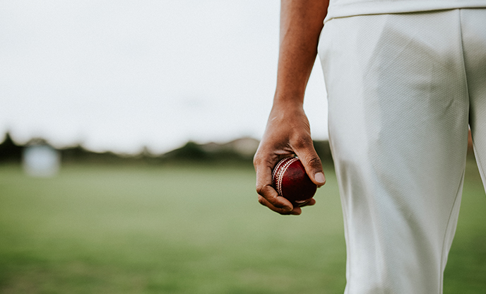cricket-player-holding-leather-ball